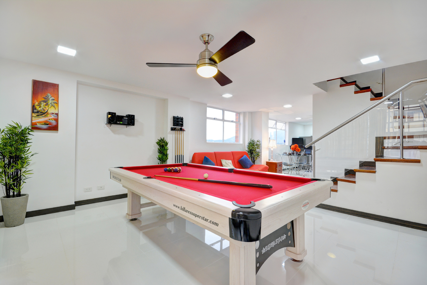 A pool table in the middle of a room.