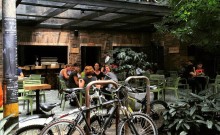 A couple of bikes are parked in front of a building