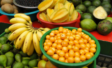 A table full of different fruits and bowls