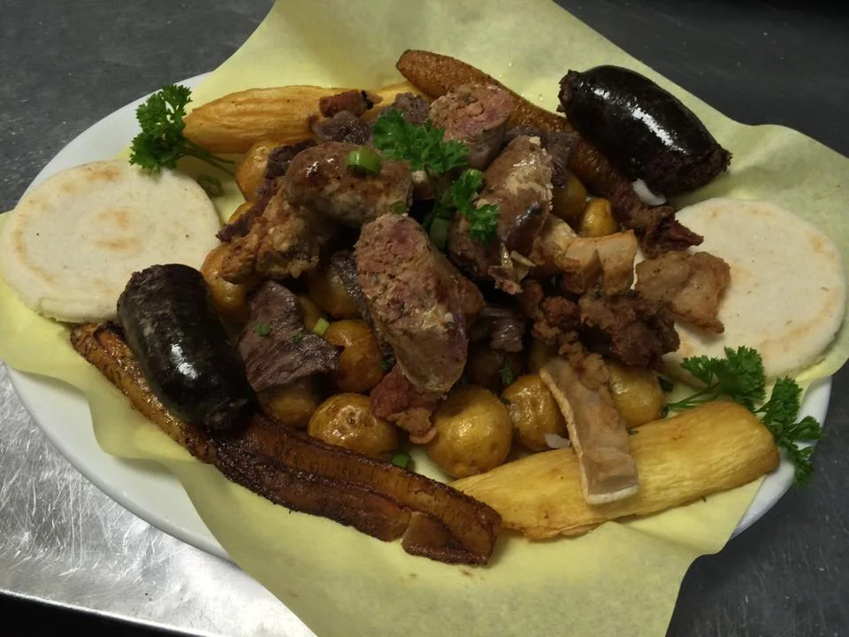 A plate of food with meat and vegetables on it.